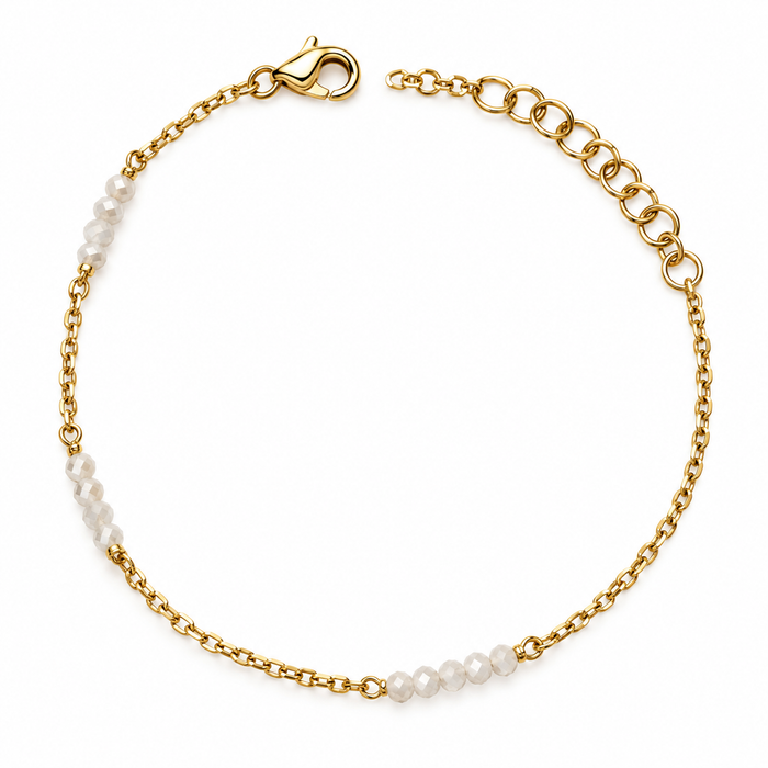 Bracciale dorato con pietre bianche sfaccettate