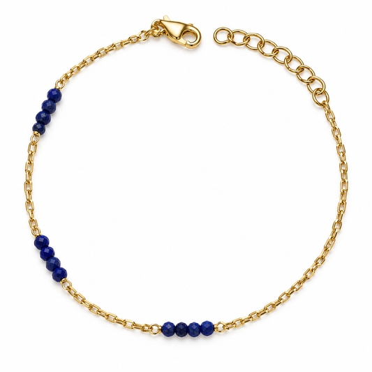 Bracciale dorato con pietre blu sfaccettate