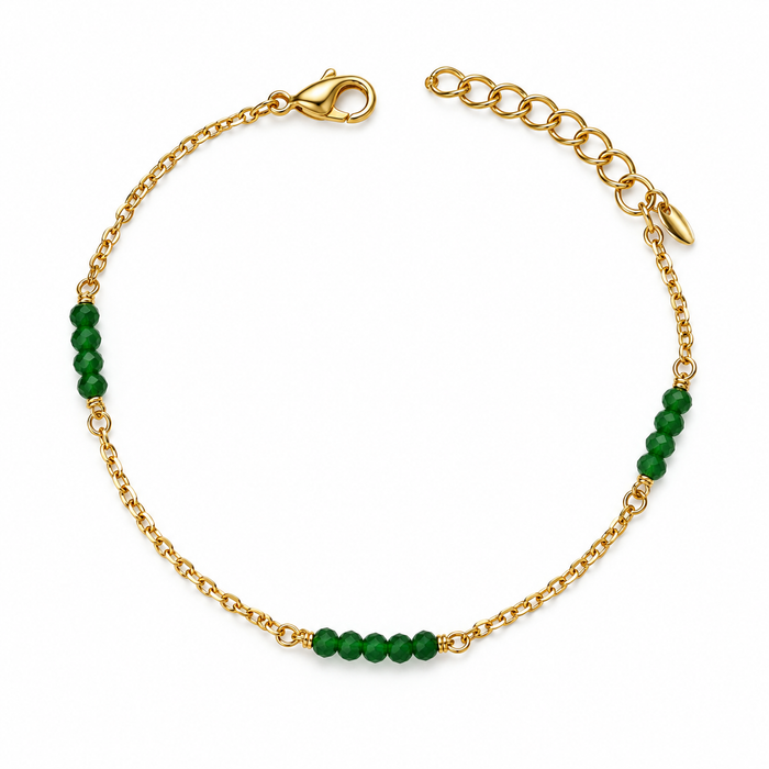 Bracciale dorato con pietre verdi sfaccettate